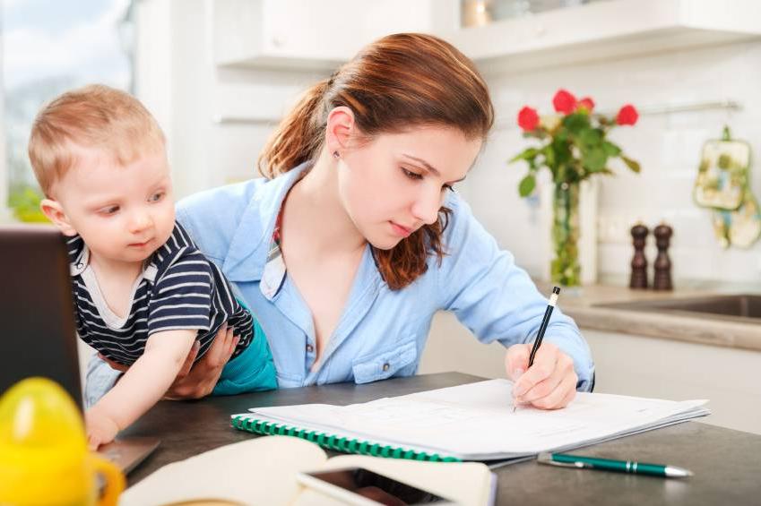 Girl studying with child